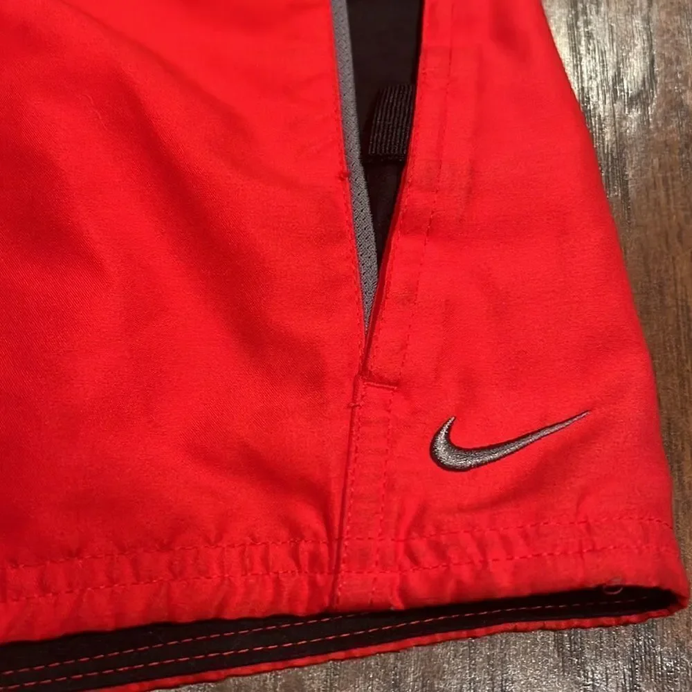 nike swim trunks size L red and black embroidered grey logo EUC with pockets